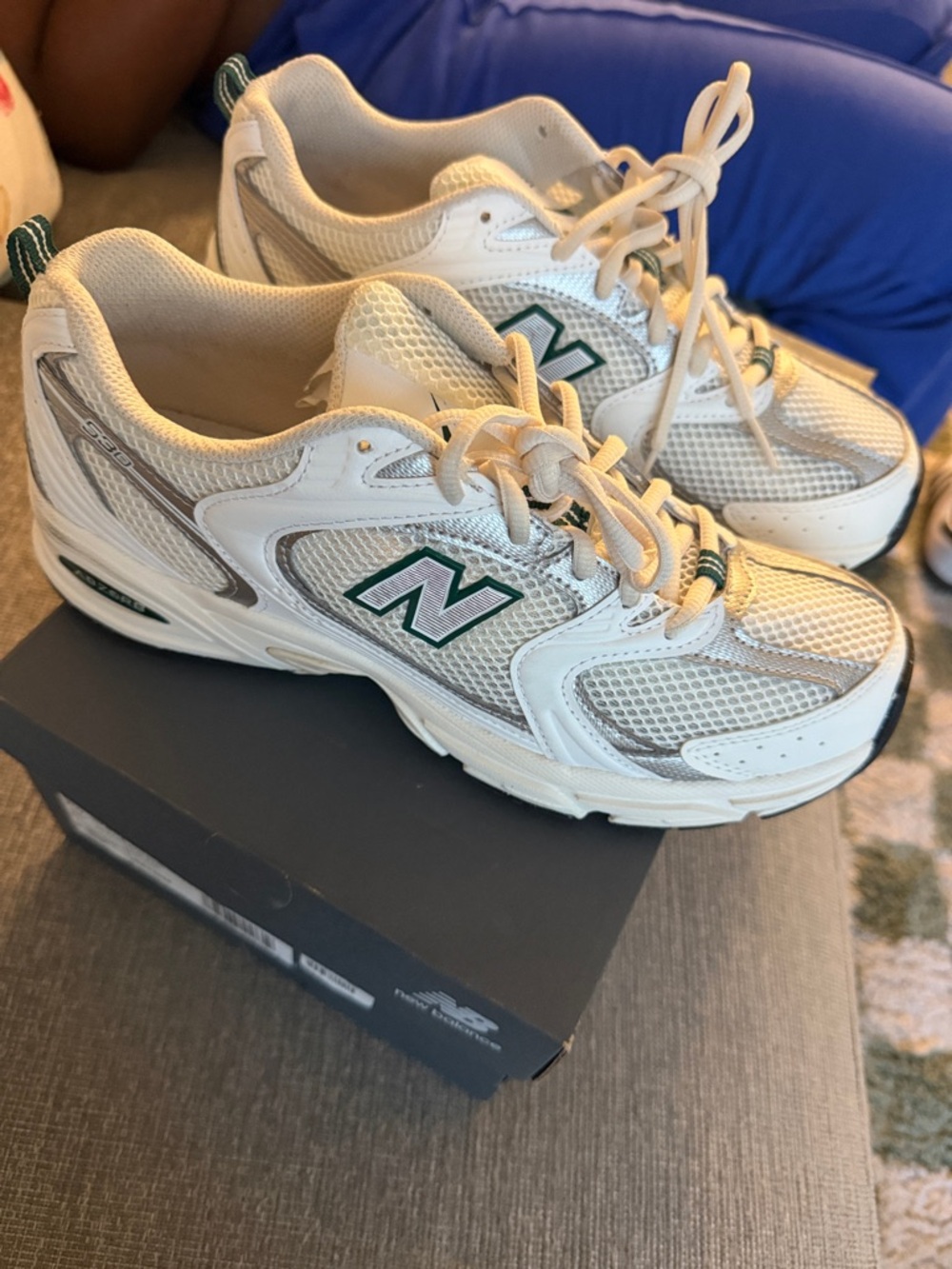 New Balance White Athletic Sneakers with Green Logo and Gray Accents